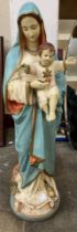 A plaster figure of Mother Mary and Baby Jesus