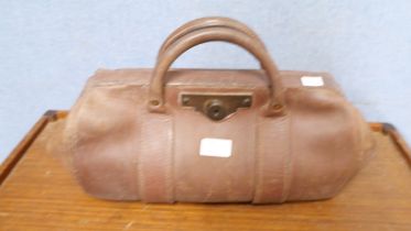 A leather Gladstone bag