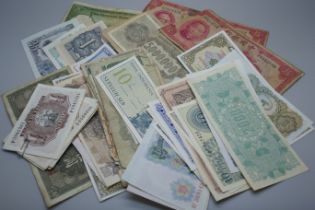 A collection of banknotes including China, Japan and Korea