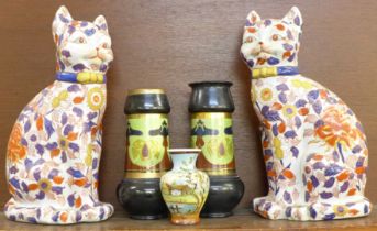 A pair of Imari cats, two Bretby Art Nouveau vases (one a/f, restored), and a small hand painted