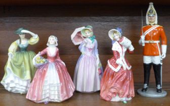 Five Royal Doulton figures; Christmas Morn, The Lifeguard, Miss Demure, Buttercup and Janet