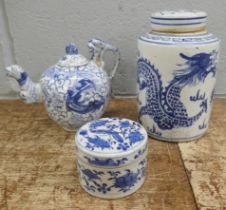 Three items of Chinese blue and white pottery; cylindrical tea caddy, a/f, tea pot and small