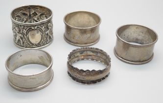 Five silver napkin rings, one pair and three others, 65g