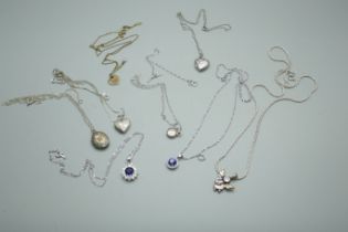 Eight silver lockets and pendants