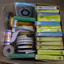 Thirty-one 8mm film reels, 1960s and three projector lamp bulbs