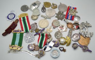 A collection of military badges and other badges including France's Day 1917 by Fattorini and