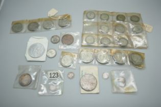 Coins including a Victorian 1889 silver double florin, Victorian silver 3d coins, a 999.9 silver