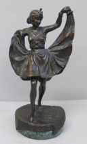 A bronze Art Deco dancing girl figure on a circular base, with a hinged skirt, 13.5cm