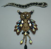 A large vintage Butler & Wilson rhinestone and crystal owl brooch in brown tones, a vintage Butler &