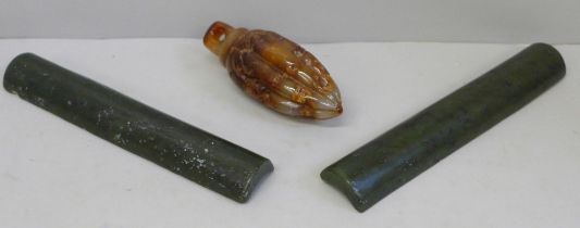 Two jade paperweights and a carved stone weight