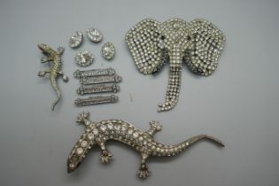A large Butler & Wilson silver plated rhinestone elephant's head brooch with articulated trunk, a