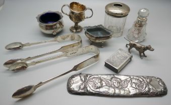 Two pairs of Victorian silver sugar bows, two silver salts, a small silver trophy, a vesta case, a