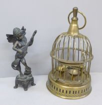 A brass bird cage and a bronze figure of a cherub playing a mandolin