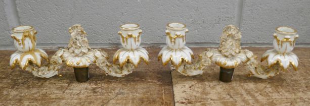 A pair of porcelain candelabra tops