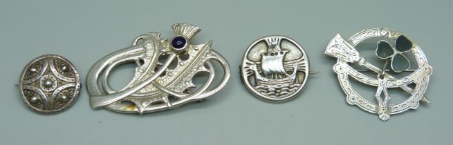 A hallmarked Scottish silver brooch with thistle detail, two other silver brooches and an unmarked