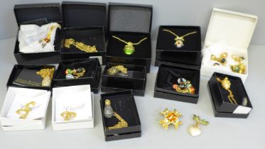 Costume jewellery; a Joan Rivers boxed egg charm bracelet, seven boxed egg necklaces, a crown and