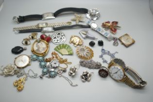 A collection of lady's and gentleman's wristwatches, costume jewellery, brooches, cufflinks, etc.
