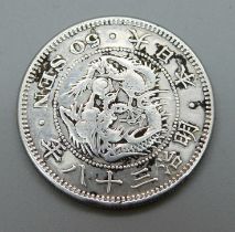 A Chinese silver coin 50 sen