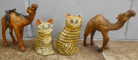 Two leather model camels and a pair of hand painted papier mache cats **PLEASE NOTE THIS LOT IS