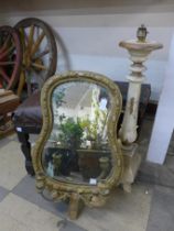 A gilt framed mirror, lamp base and stool