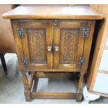 A small carved oak cupboard