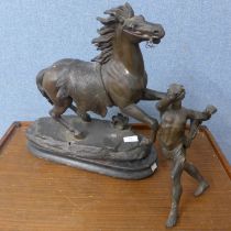 A spelter figure of a horse and man