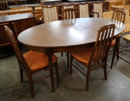 A Sutcliffe of Todmorden S-Form tola wood table and chairs