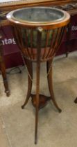 An Edward VII mahogany jardiniere on stand