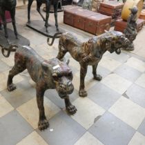 A pair of large Oriental bronze figures of tigers