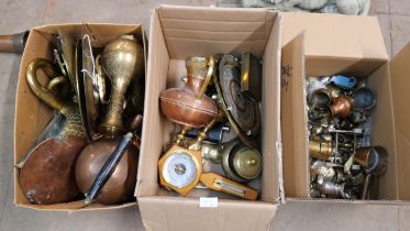 A collection of metalware including brass ornaments, candlesticks, a copper kettle, copper pan,