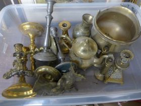 A collection of brass and pewter candlesticks, Indian brass vase, teapot, etc.