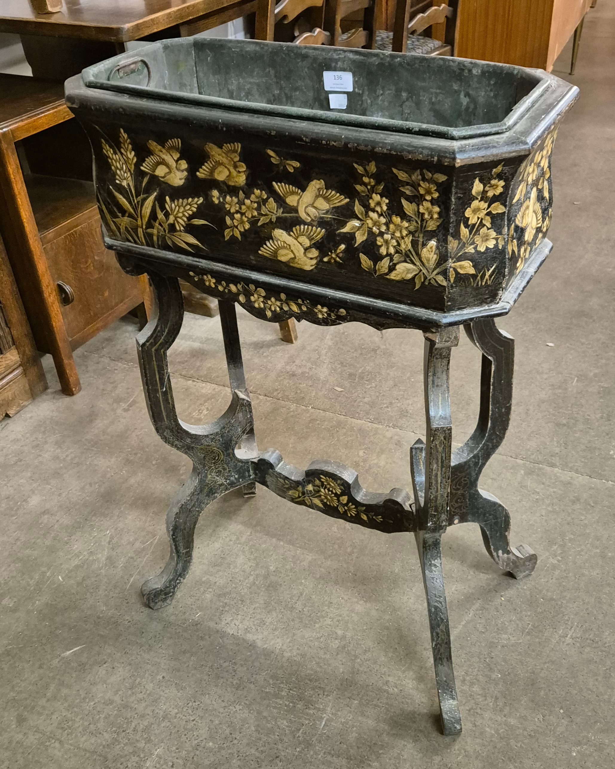 A 19th Century French black Japanned octagonal jardiniere on strand