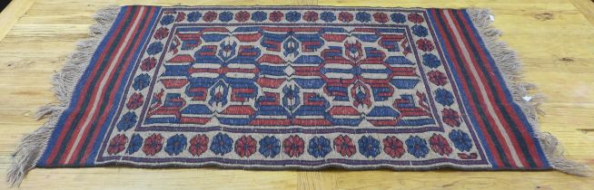 A blue and red Afghan Kelim rug, 64cm x 135cm