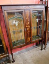 An Art Nouveau inlaid mahogany side cabinet