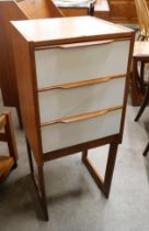 A teak and white laminate chest of drawers