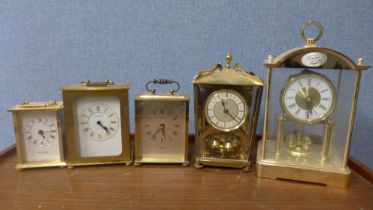 Five brass clocks