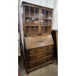An oak buerau bookcase