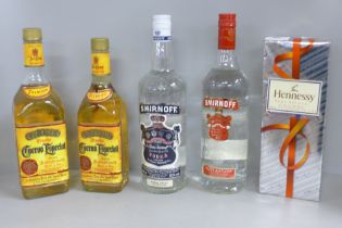 Five bottles of spirits, Hennessy Very Special Cognac, two Cuervo Especial Tequila and two