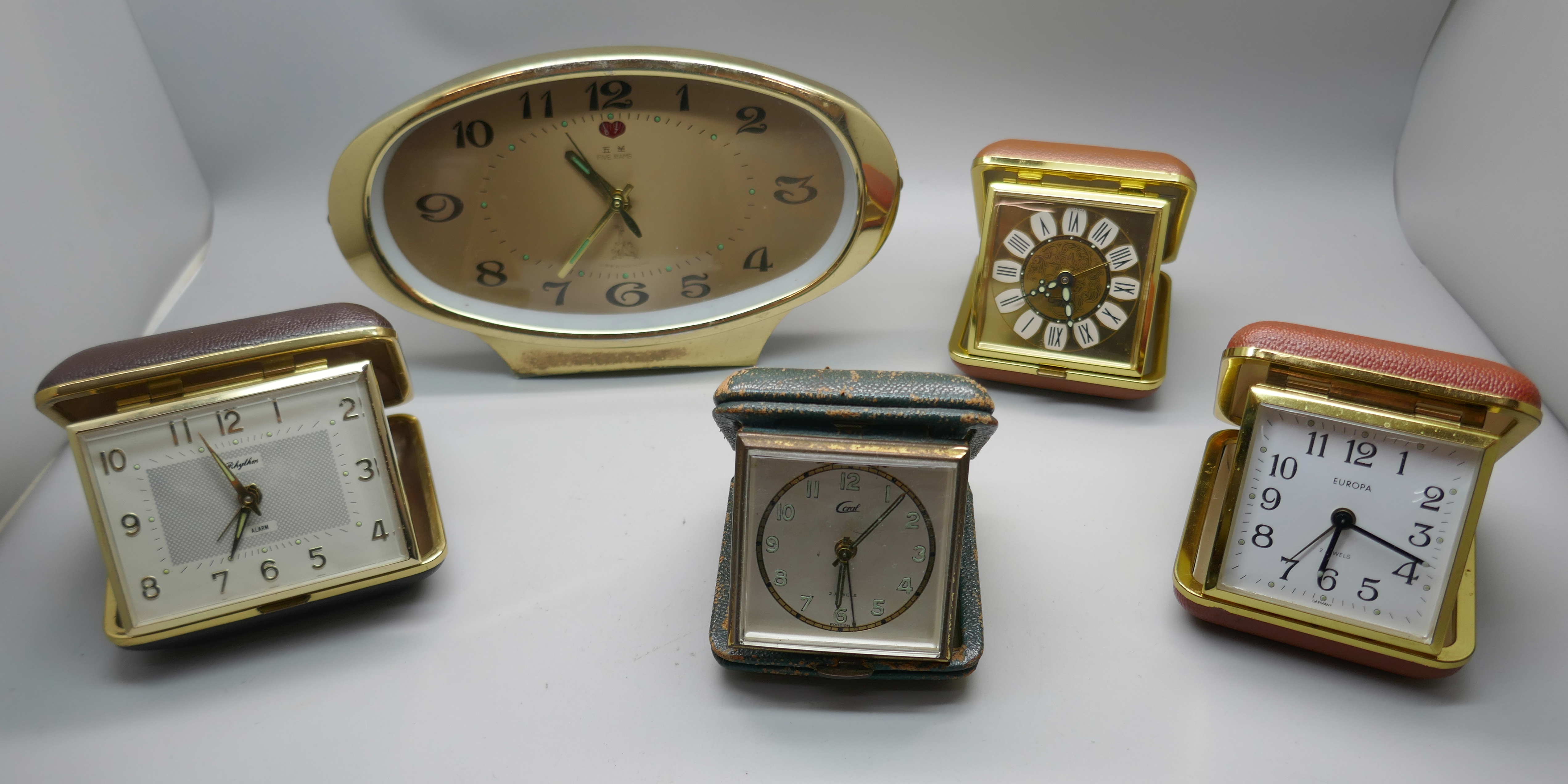 Four travel clocks and a retro Chinese clock