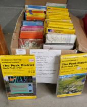 A box of Ordnance Survey maps for Wales, Lake District, Peak District, road maps of France, street