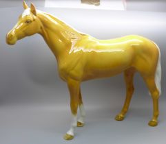 A large Beswick Palomino racehorse