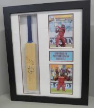 A presentation framed mounted cricket bat, signed by West Indies legend Chris Gayle