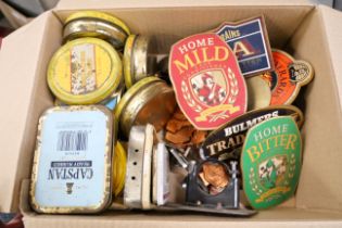 A box of fourteen metal beer pull labels including Youngs, Theakston, Everards and Home Bitters