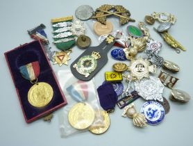 A box of badges and medallions, 1902 Coronation Medallion; Royal Artillery collar badge; Royal