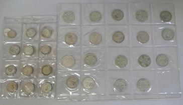 Two album pages of mixed silver and half silver coins