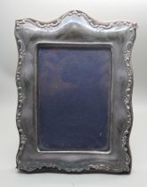 A hallmarked silver photograph frame, London 1991, height 21cm
