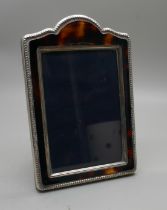 A silver photograph frame, height 12cm, faux tortoiseshell