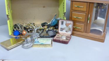 A box of costume jewellery and a jewellery cabinet