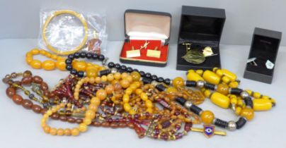 Costume jewellery, cufflinks, rings, amber coloured beads, etc.