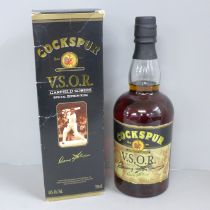 A bottle of Cockspur V.S.O.R. Special Edition Garfield Sobers Rum hand signed on the label by
